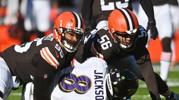 Dec 12, 2021; Cleveland, Ohio, USA; Cleveland Browns defensive end Myles Garrett (95) looks up to check the spot after tackling Baltimore Ravens quarterback Lamar Jackson (8) during the first quarter at FirstEnergy Stadium. Mandatory Credit: Ken Blaze-USA TODAY Sports